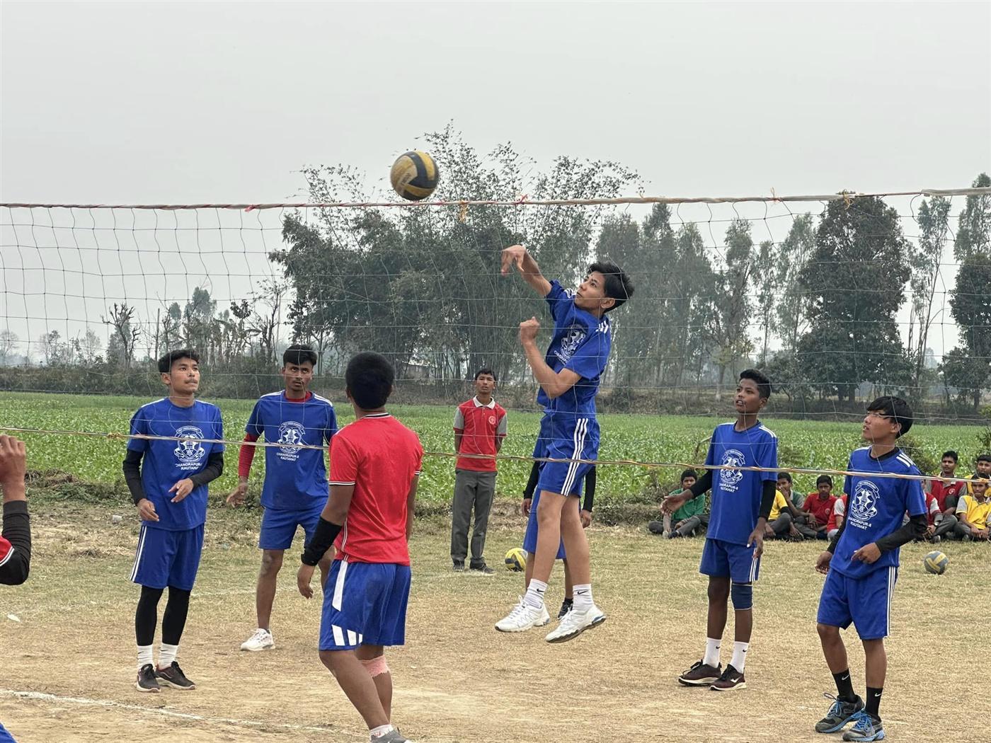 Students playing volleyball